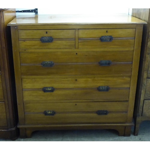 217 - An Edwardian satin mahogany dressing chest with two short/three long drawers with cast metal bale ha... 