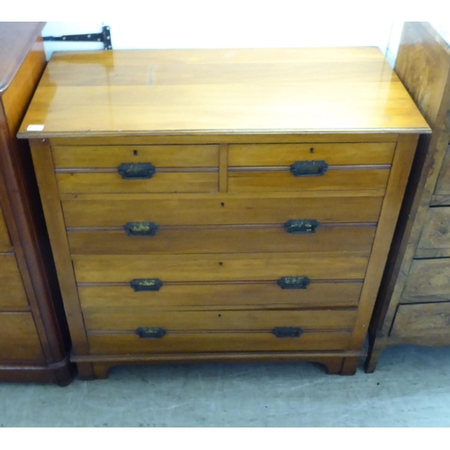 217 - An Edwardian satin mahogany dressing chest with two short/three long drawers with cast metal bale ha... 