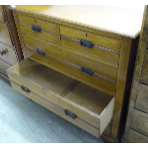 217 - An Edwardian satin mahogany dressing chest with two short/three long drawers with cast metal bale ha... 