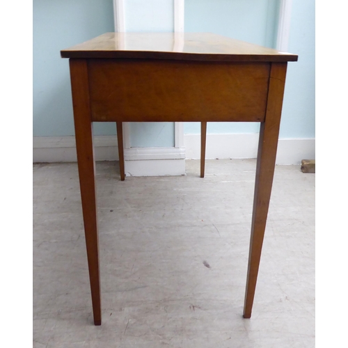 22 - A late 19th/early 20thC mahogany two drawer hall table, raised on square, tapered legs  28