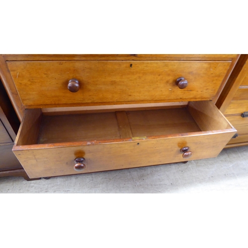 221 - A late Victorian satin mahogany dressing chest with two short/three graduated long drawers, on a pli... 