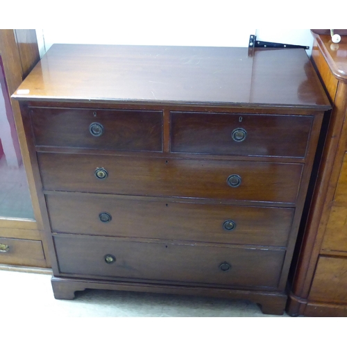 226 - A mid Victorian mahogany dressing chest, the two short/three graduated long drawers with brass ring ... 