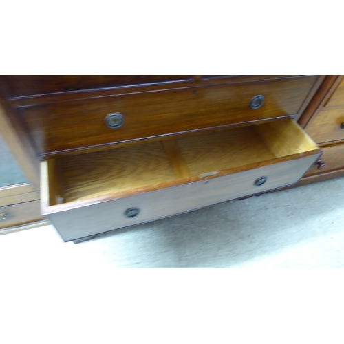 226 - A mid Victorian mahogany dressing chest, the two short/three graduated long drawers with brass ring ... 