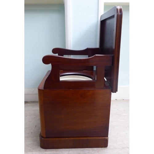 23 - A late Victorian mahogany night commode with straight sides and a hinged lid, on a plinth  17