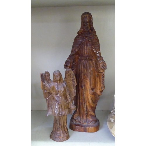 235 - A mixed lot: to include religious themed, carved wooden items