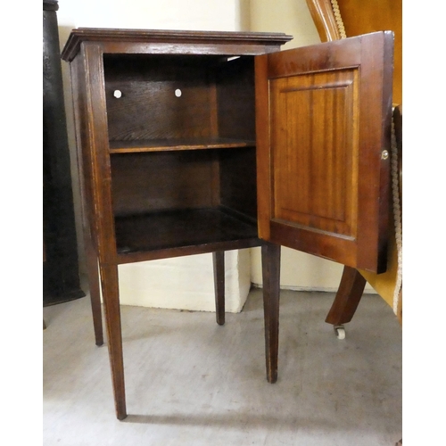 236 - An early 20thC mahogany bedside cupboard with a tray top, frieze drawer and undershelf, over a fall ... 