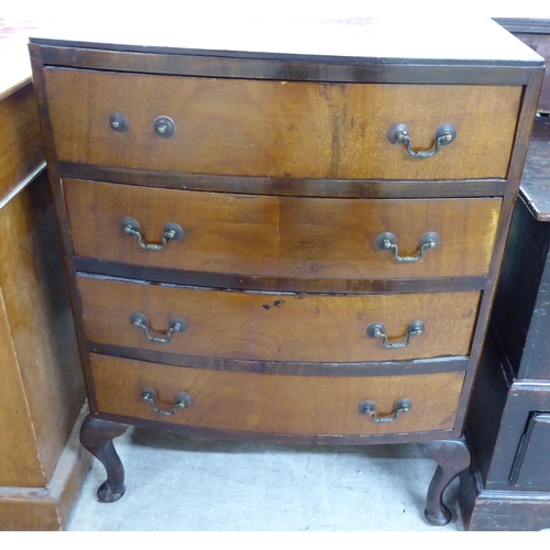 237 - A 1930s bow front, mahogany chest with four drawers and brass bale handles, raised on short cabriole... 