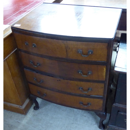 237 - A 1930s bow front, mahogany chest with four drawers and brass bale handles, raised on short cabriole... 