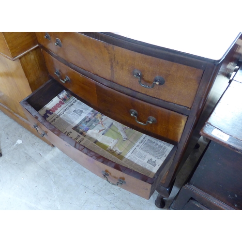 237 - A 1930s bow front, mahogany chest with four drawers and brass bale handles, raised on short cabriole... 