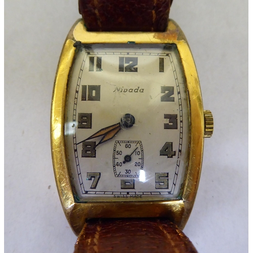 245 - A Nivada rolled gold cased, manual wind wristwatch, faced by an Arabic dial, on a brown leather stra... 