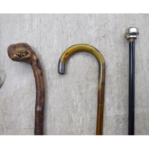 25 - Six variously themed and made 20thC walking sticks