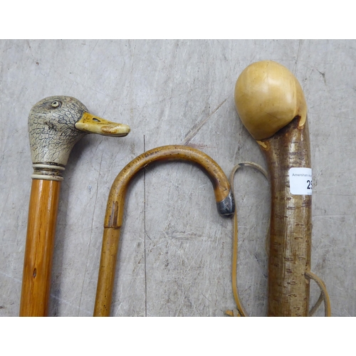 25 - Six variously themed and made 20thC walking sticks