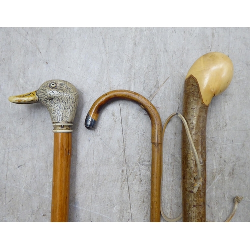 25 - Six variously themed and made 20thC walking sticks