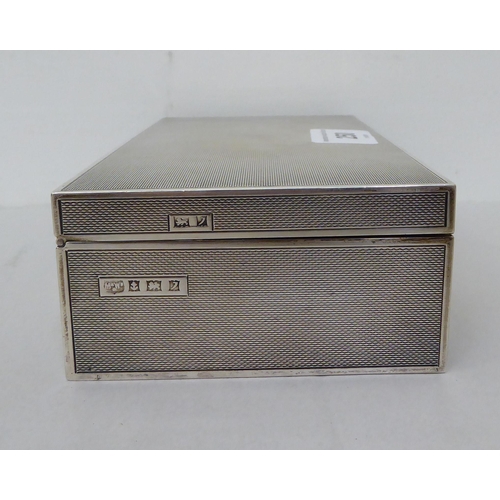 250 - A silver cigarette box with engine turned decoration  Birmingham 1958  7