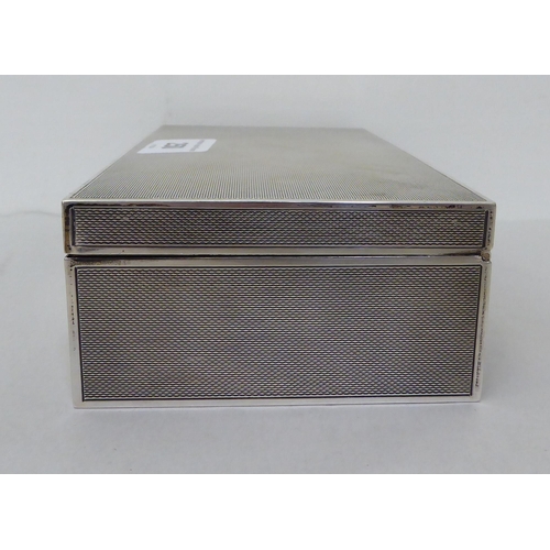 250 - A silver cigarette box with engine turned decoration  Birmingham 1958  7