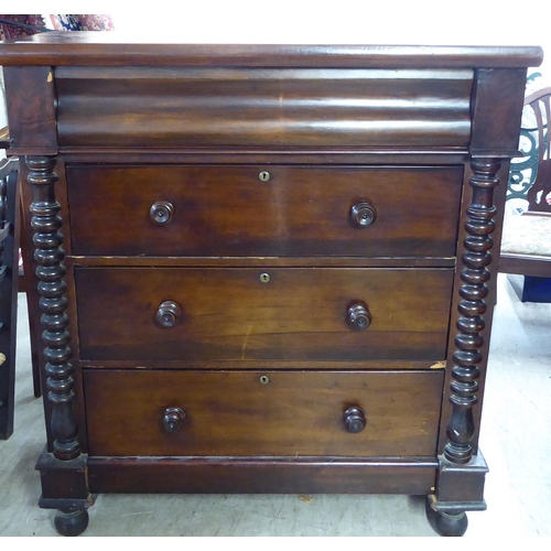 256 - A late Victorian mahogany dressing room chest, comprising four long drawers between spiraltwist, fla... 