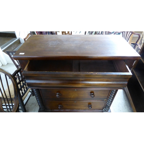 256 - A late Victorian mahogany dressing room chest, comprising four long drawers between spiraltwist, fla... 