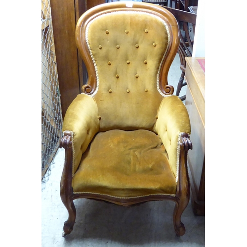 257 - A late Victorian mahogany framed grandfather chair with a high spoonback, upholstered in old gold fa... 