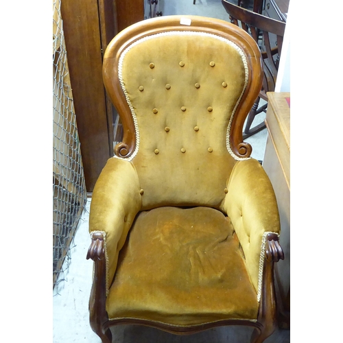 257 - A late Victorian mahogany framed grandfather chair with a high spoonback, upholstered in old gold fa... 