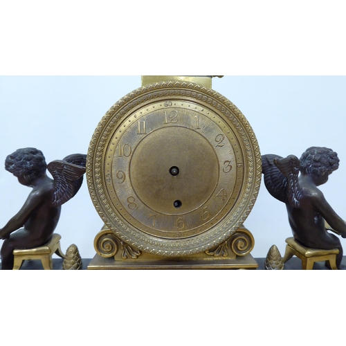 261 - An early 20thC French bi-coloured, cast metal mantel clock  14