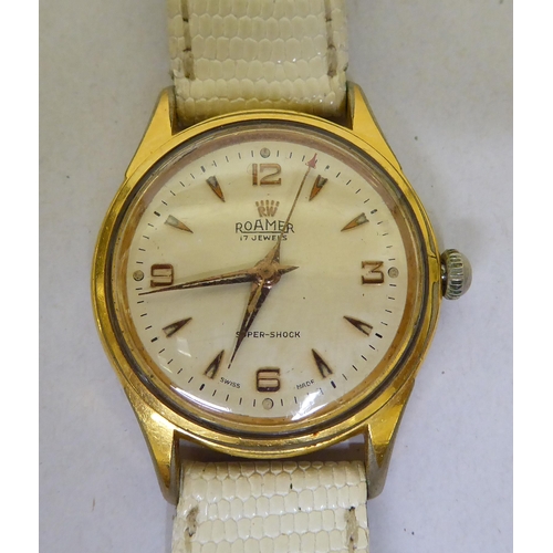 293 - A Roma gold plated, manual wind wristwatch, faced by a baton dial, on a white leather strap