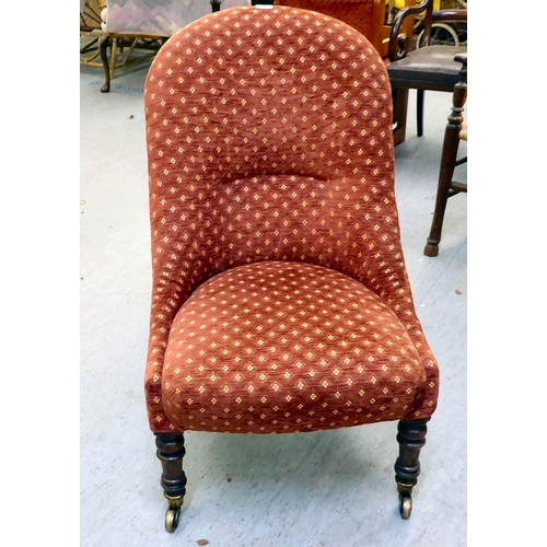 294 - A late 19thC rosewood framed and later red fabric upholstered nursing chair, raised on turned forele... 