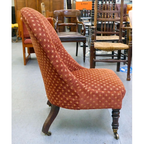 294 - A late 19thC rosewood framed and later red fabric upholstered nursing chair, raised on turned forele... 