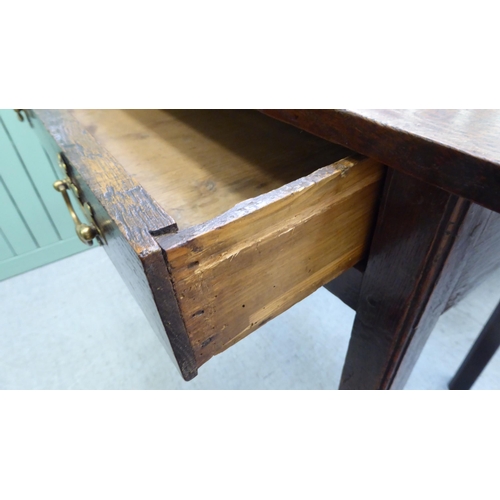 297 - A George III oak, single drawer side table, raised on square legs  28