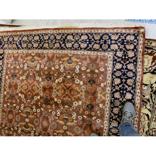 30 - A Persian rug, decorated with small flower head designs and a border, on a multi-coloured ground&nbs... 