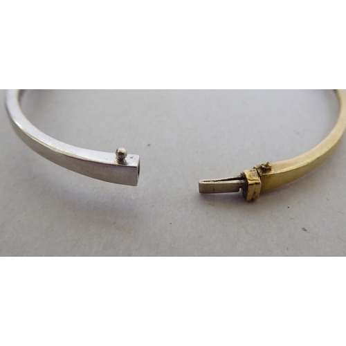 300 - A 9ct gold diamond set bangle