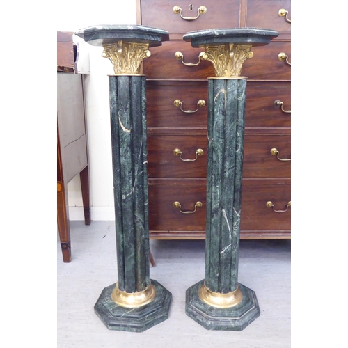 302 - A pair of modern 19thC Italian style, mottled green marble and gilt metal, reeded capital pedestals,... 