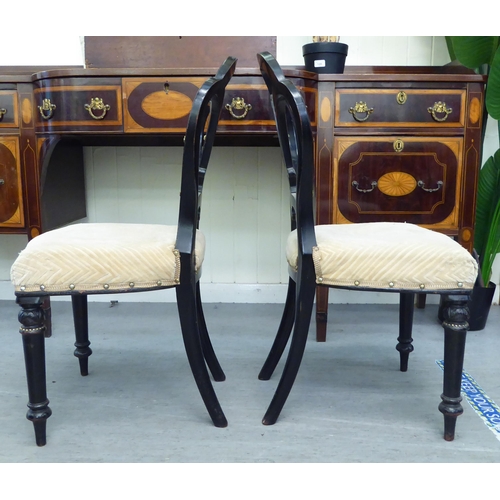 305 - A pair of late Victorian, ebonised framed and gilt, button effect chairs with later fabric upholster... 