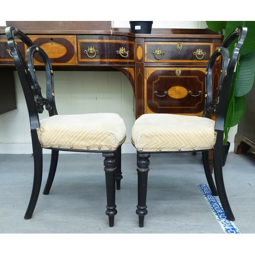 305 - A pair of late Victorian, ebonised framed and gilt, button effect chairs with later fabric upholster... 