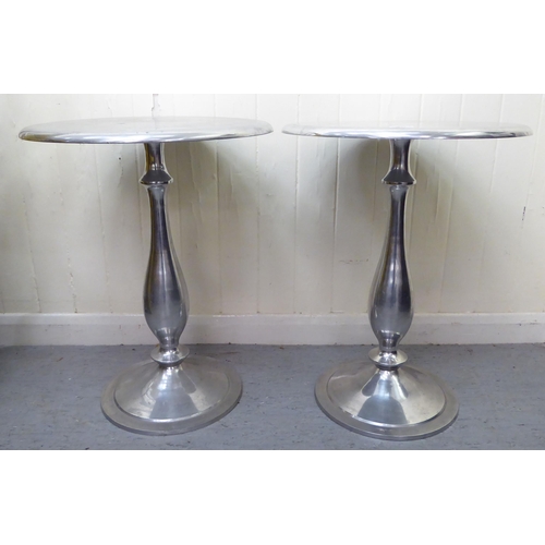 306 - A pair of modern cast metal, pedestal wine tables  26