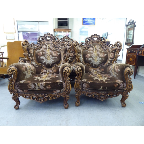 307 - A modern elaborate Italian influenced, carved and stained beech three piece suite  comprising a... 