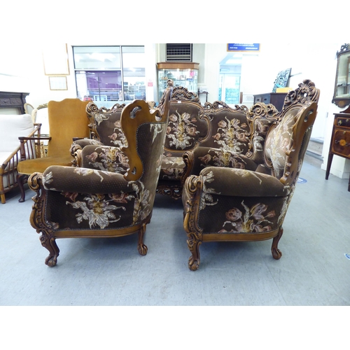 307 - A modern elaborate Italian influenced, carved and stained beech three piece suite  comprising a... 