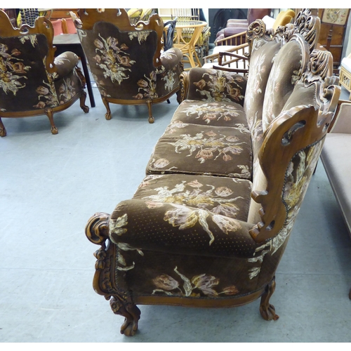 307 - A modern elaborate Italian influenced, carved and stained beech three piece suite  comprising a... 