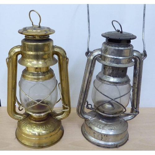 316 - Four reproductions of tin portable paraffin lamps  largest 15