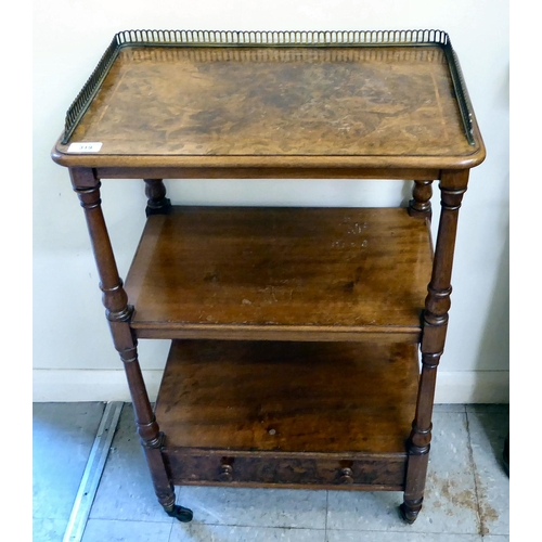 319 - An early 20thC walnut and mahogany three tier, single drawer what-not, raised on turned, pillar supp... 