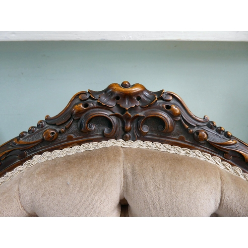 32 - A mid Victorian, carved mahogany. showwood framed and later part-button fabric upholstered nursing c... 