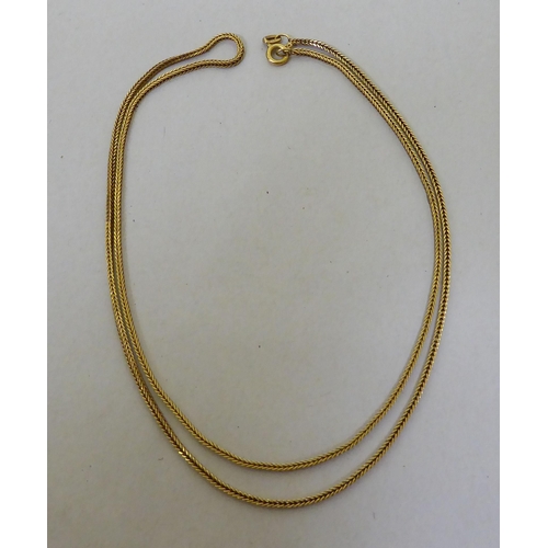 325 - A yellow metal neckchain  stamped Italy 750