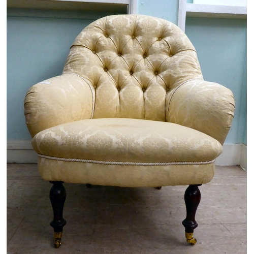 37 - A 20thC Victorian style, floral fabric pattern upholstered nursing chair, raised on turned beech leg... 