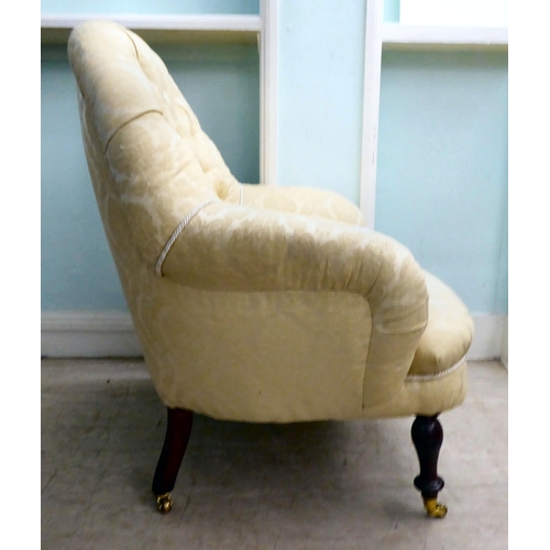 37 - A 20thC Victorian style, floral fabric pattern upholstered nursing chair, raised on turned beech leg... 