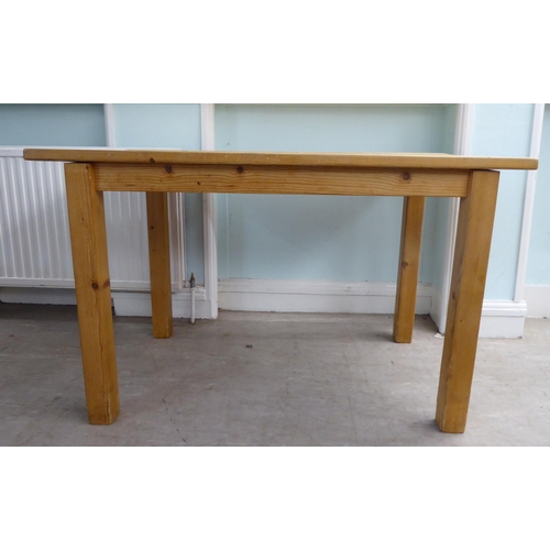 38 - A 20thC pine table, raised on square legs  29