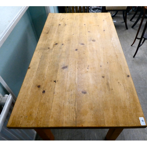 38 - A 20thC pine table, raised on square legs  29