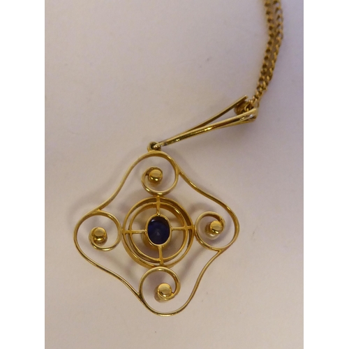 45 - A late Victorian 15ct gold pendant, set with seed pearls and a sapphire, on a 9ct gold chain; and an... 