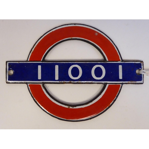 53 - A London Underground enamelled Bullseye plate from driving car 11001  3.75