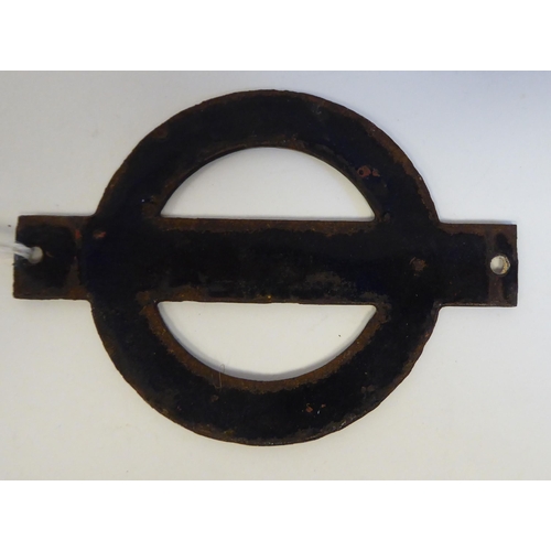 53 - A London Underground enamelled Bullseye plate from driving car 11001  3.75