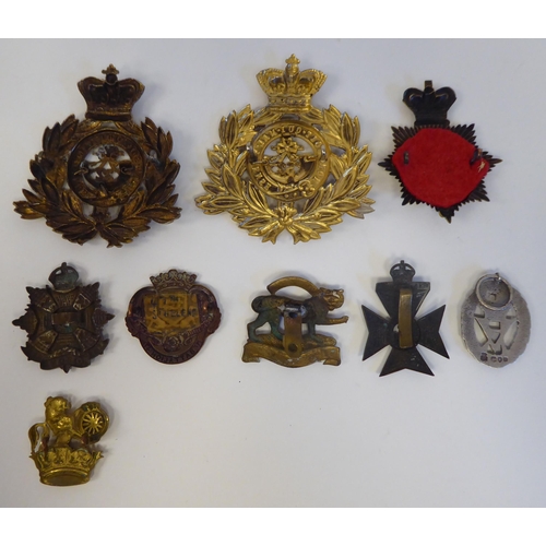 59 - Cast metal and one fabric military themed badges, some copies(Please Note: this lot is subject to th... 