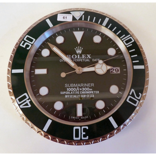 61 - A dealer display advertising wall timepiece for Rolex Oyster Perpetual; the movement faced by a bato... 